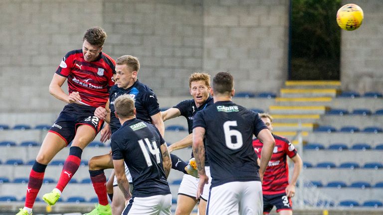 Dundee's Jack Hendry (left) heads home the winner at Stark's Park