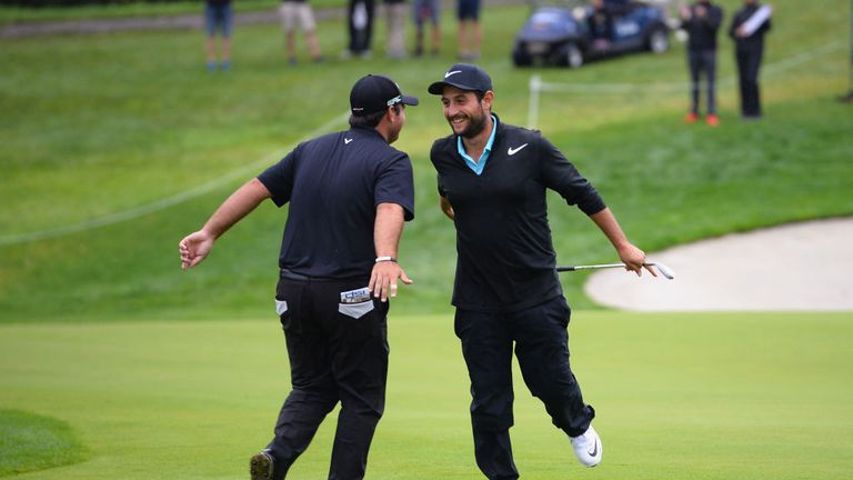 Patrick Reed (left) and Alexander Levy were having fun during their rain-delayed second round