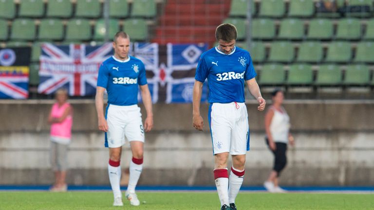 Rangers' Jordan Rossiter (R) and Kenny Miller are dejected after the second goal