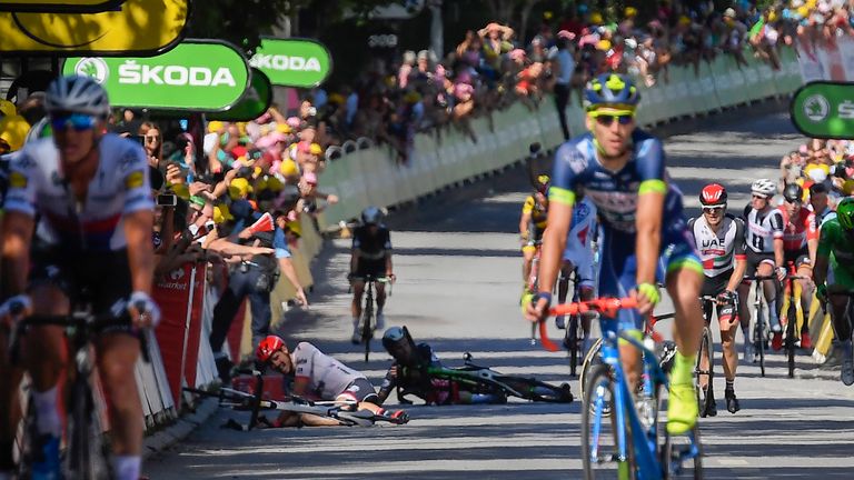 Cavendish and John Degenkolb lie on the ground after falling near the finish line