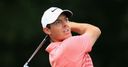 McIlroy battles to improved 68