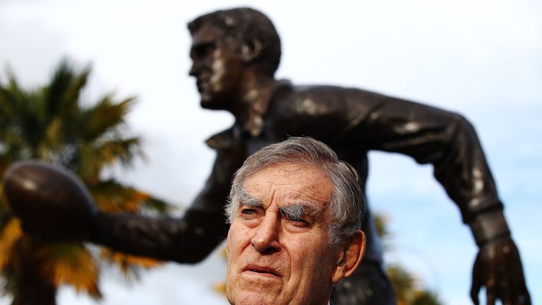 Sir Colin Meads poses in front of a statue of himself which was unveiled in Te Kuiti during the Lions' tour to New Zealand earlier this year