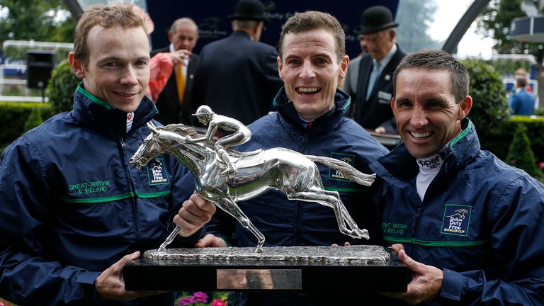 Jamie Spencer (L), Fran Berry (C) and Neil Callan lift the Shergar Cup for Great Britain & Ireland at Ascot