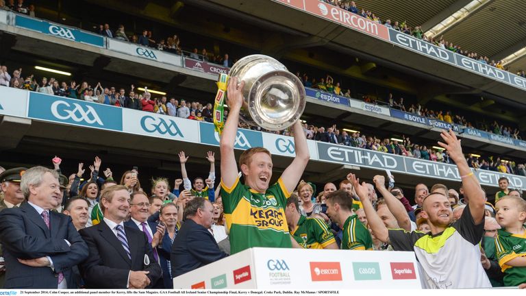 Colm Cooper, an additional panel member for Kerry, lifts the Sam Maguire. in 2014