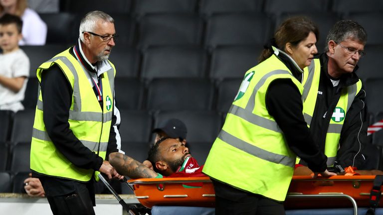 Swansea defender Kyle Bartley was taken off injured on a stretcher