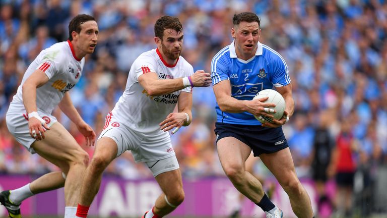 Philip McMahon of Dublin against Ronan McNamee, centre, and Colm Cavanagh of Tyrone