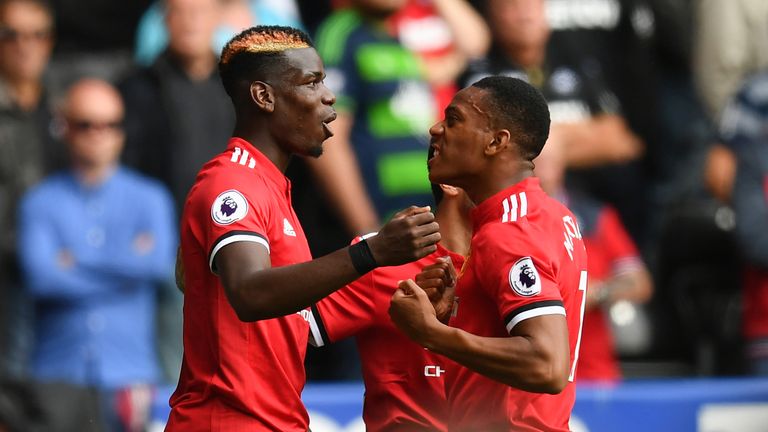 Anthony Martial celebrates scoring Manchester United's fourth with Paul Pogba