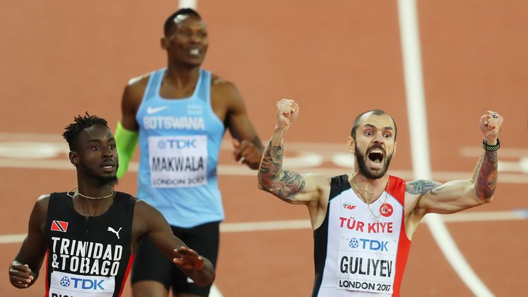 Ramil Guliyev celebrates as he crosses the line to win the men's 200m final