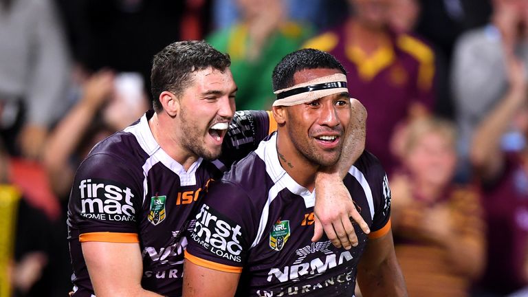 Tautau Moga is congratulated by his Broncos team mate Corey Oates