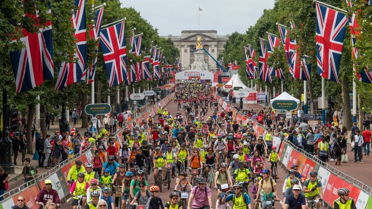 Riders cycle up The Mall, as part of the FreeCycle Prudential RideLondon