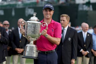 Justin Thomas poses with the Wanamaker Trophy