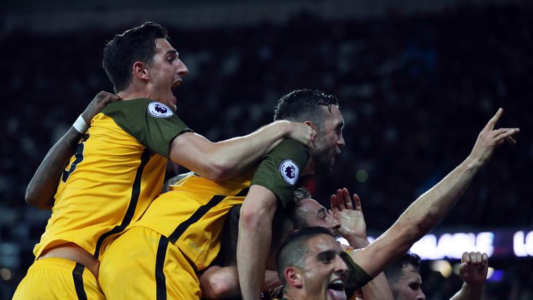 Brighton players celebrate their third goal of the game at West Ham, scored by Murray from the penalty spot