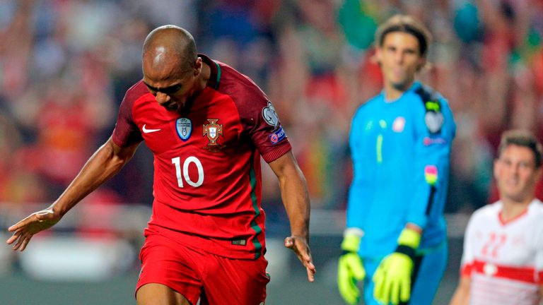 Portugal's Joao Mario celebrates following Swiss defender Johan Djourou's own goal