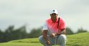 Tiger 'optimistic but realistic'