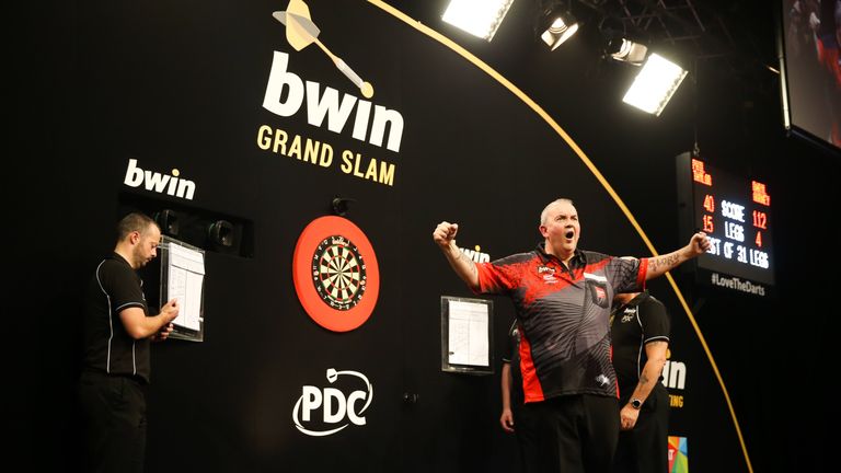 Phil Taylor is into the Grand Slam semi-final and will face Michael van Gerwen