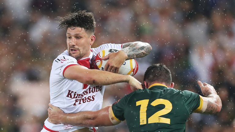 Gareth Widdop of England is tackled by Matt Gillett of Australia