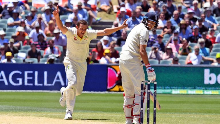 Josh Hazlewood (L) celebrates dismissing England captain Joe Root (R)