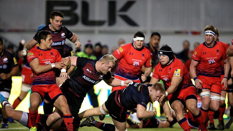 Jackson Wray of Saracens dives over for a try