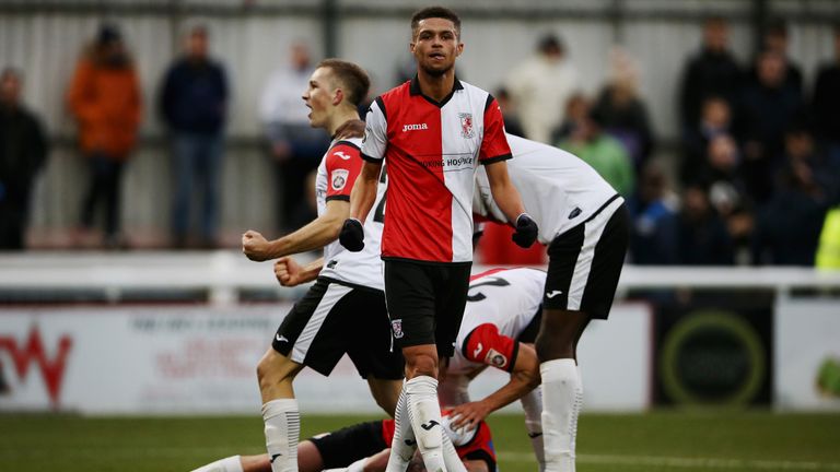 Kane Ferdinand of Woking celebrates Joe Ward's goal against Peterborough