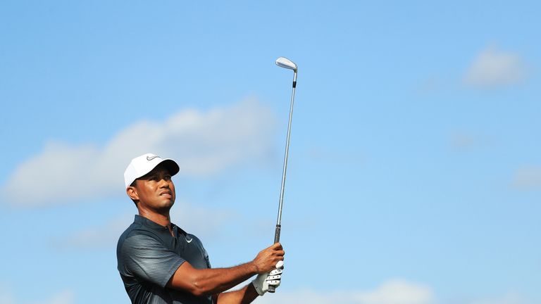 Woods is 10 shots off the lead, but he is happy to be back in competition