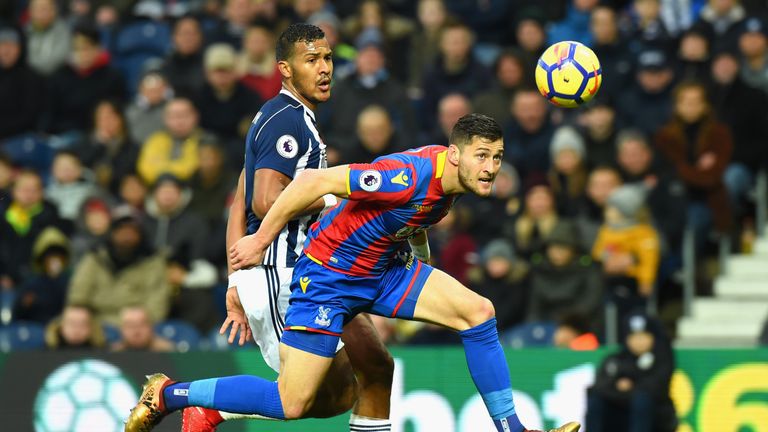 Crystal Palace defender Joel Ward (right) wins a header while under pressure from West Brom striker Salomon Rondon