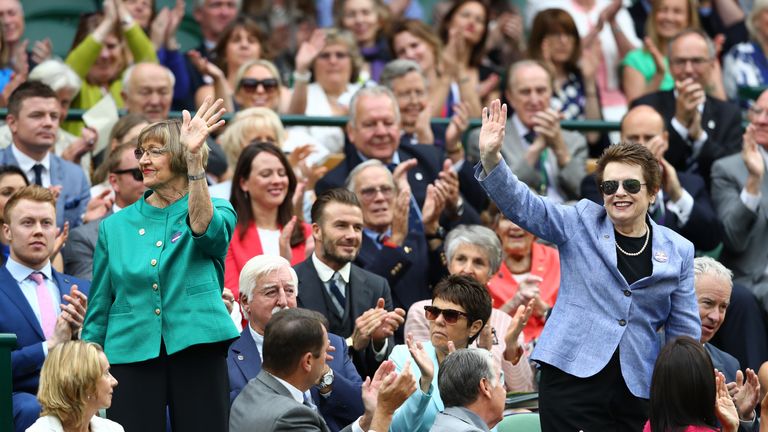 Margaret Court (l) and Billie Jean King (r) wave to the crowd at Wimbledon in 2016