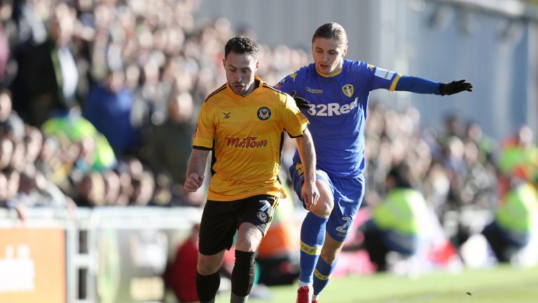 Newport's Robbie Willmott and Leeds' Pawel Cibicki battle for the ball