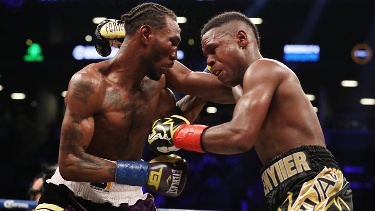 Robert Easter Jr. (left) and Javier Fortuna exchange punches during their IBF lightweight title bout