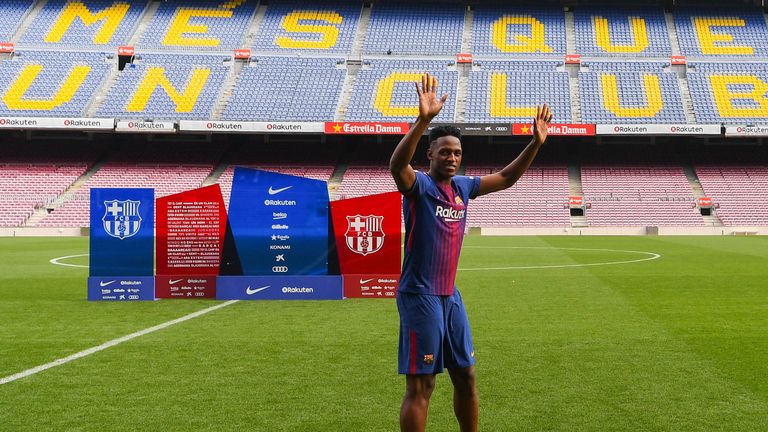 Mina walked onto the Nou Camp pitch without his boots