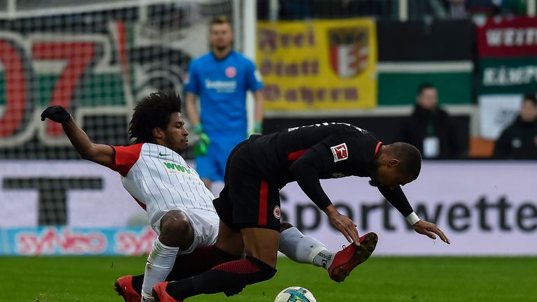 Augsburg's Caiuby tackles Frankfurt's Kevin-Prince Boateng