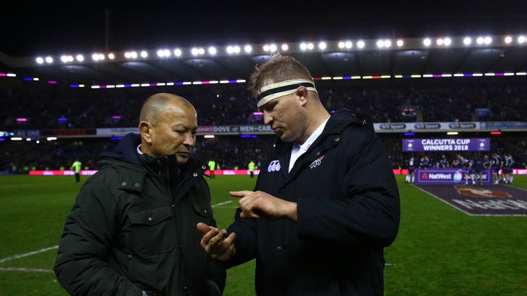 Eddie Jones talks with England captain Dylan Hartley after the loss to Scotland