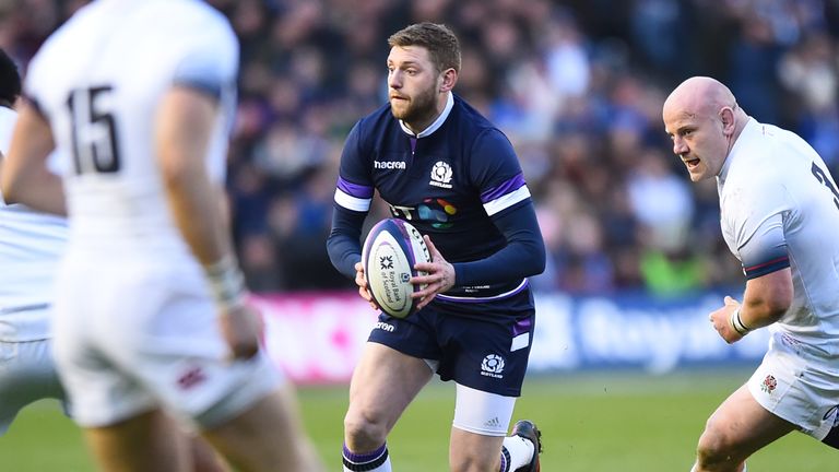 Scotland's fly-half Finn Russell makes a break against England
