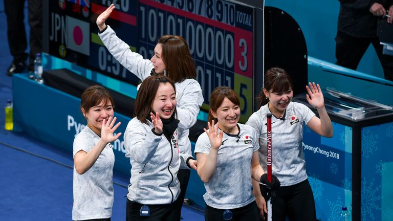 Japan's players celebrate after winning the bronze medal game
