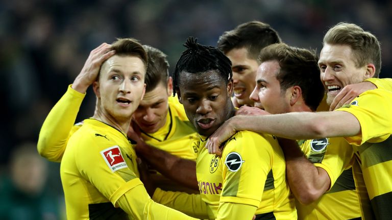 Marco Reus (left) celebrates his first goal since May with his Dortmund team-mates