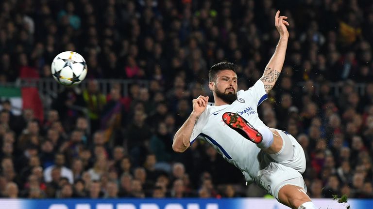 Olivier Giroud volleys at goal in the Nou Camp