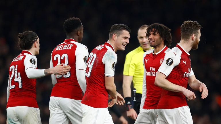 Arsenal secured their place in the Europa League last eight with a 3-1 second-leg win over AC Milan