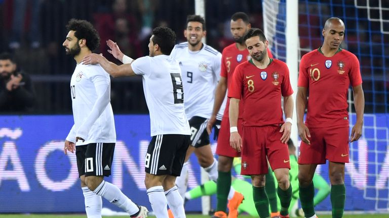 Egypt forward Mohamed Salah is congratulated after opening the scoring against Portugal
