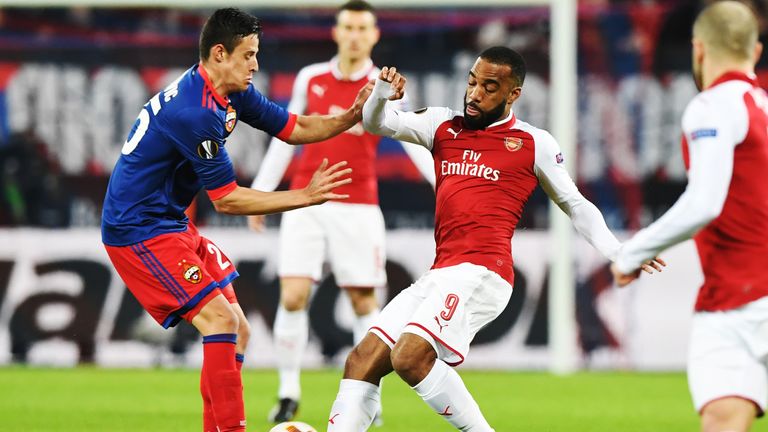 CSKA Moscow midfielder Kristijan Bistrovic (L) is challenged by Arsenal striker Alexandre Lacazette 