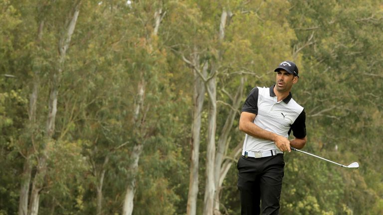 Alvaro Quiros snatched the lead back with a birdie at the last