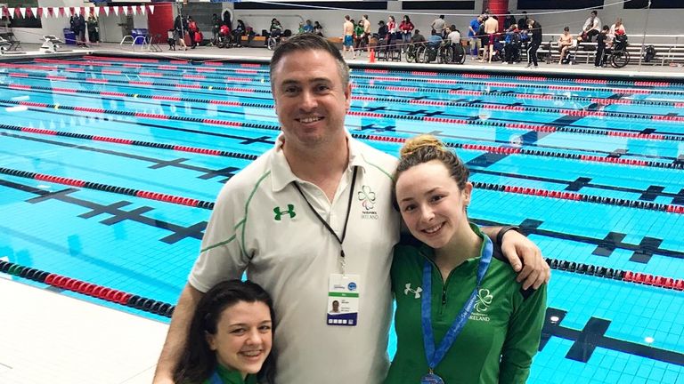 Ellen soaks up the attention with Nicole Turner (left) and coach Dave Malone