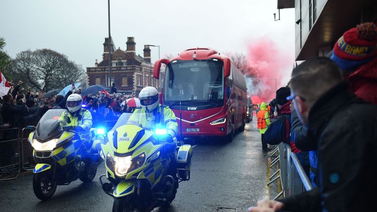The Liverpool team bus arrives at Anfield before the game