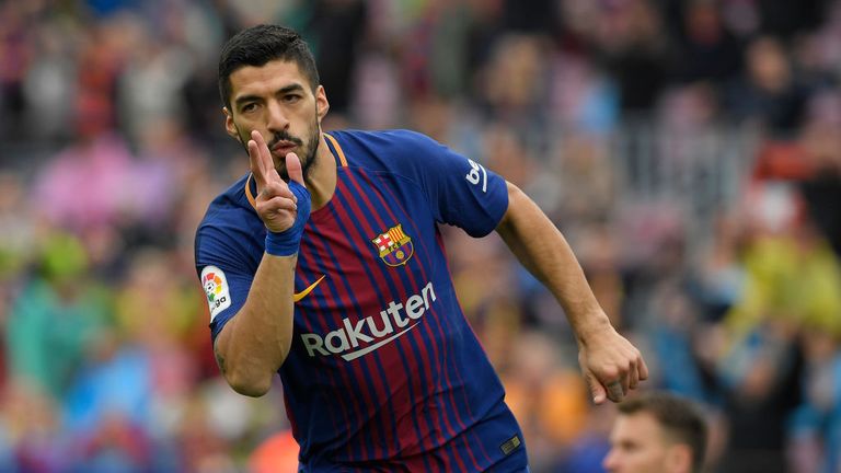 Luis Suarez celebrates his first-half goal against Valencia