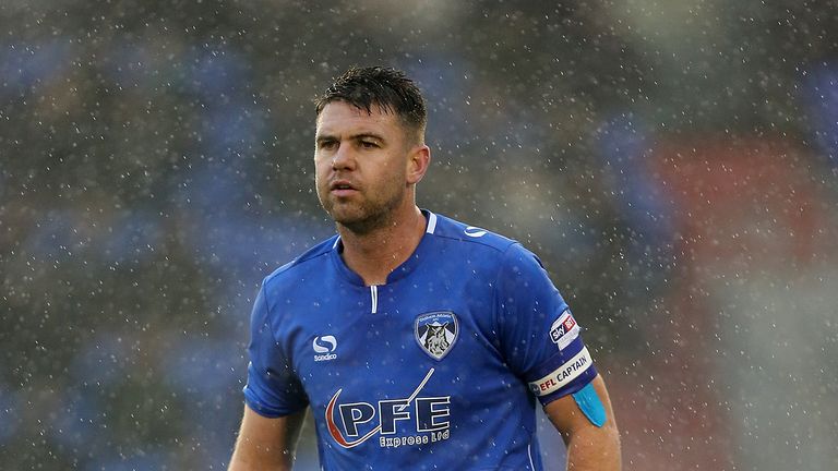 Fan runs on pitch to confront referee during Rochdale's draw with Oldham