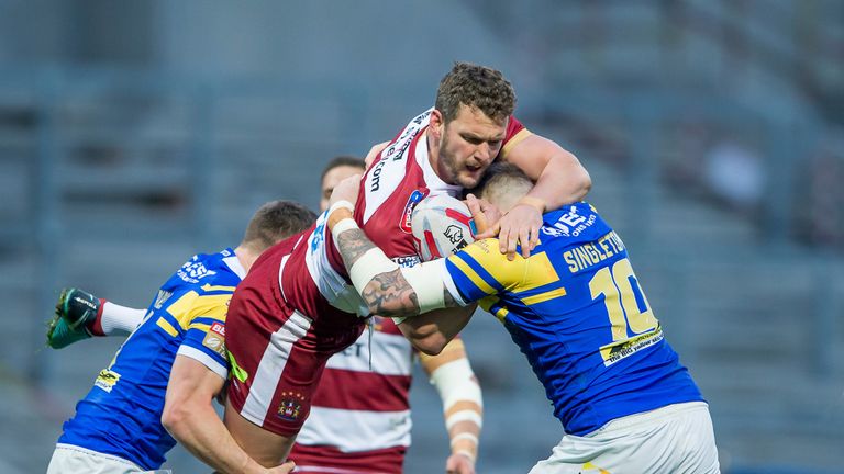 Wigan's Sean O'Loughlin is tackled by Stevie Ward and Brad Singleton