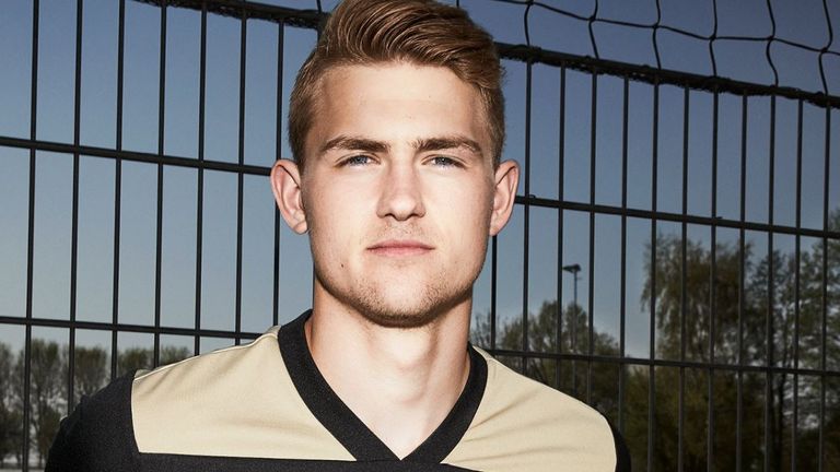 The Ajax away kit comes in black, gold and white, manufactured by Adidas