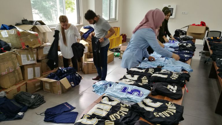 Volunteers at Ishik University in Northern Iraq prepare to distribute the kit