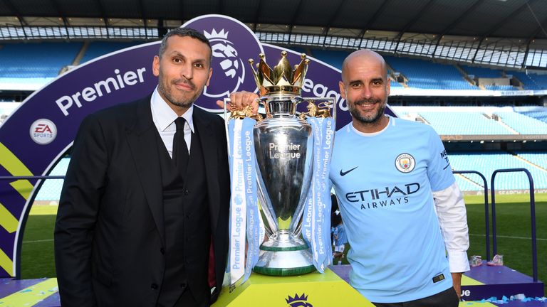 Manchester City chairman Khaldoon Al Mubarak and Guardiola celebrate with the Premier League trophy
