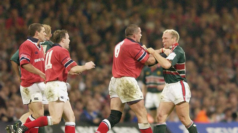Munster's Alan Quinlan gets to grips with Leicester's Neil Back in the 2002 final