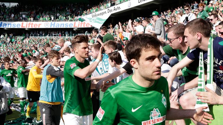 The Greek defender salutes the Bremen fans after his final game for the club
