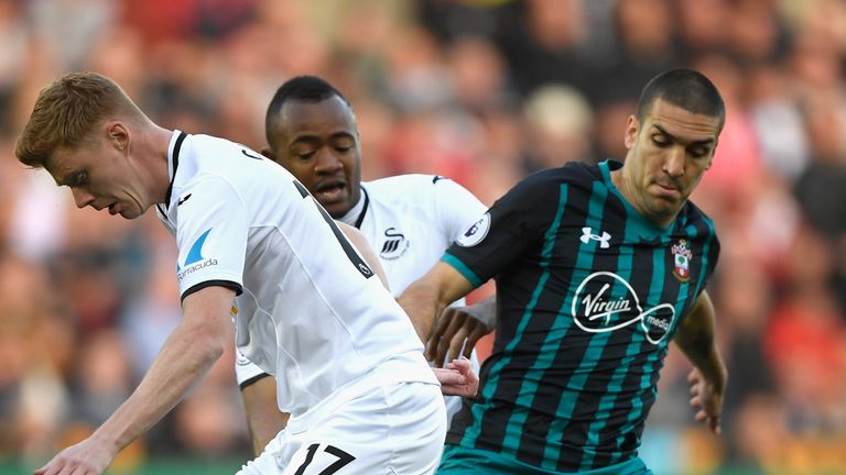 Oriol Romeu takes on Clucas in the first half